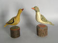 Two carved and painted birds in the manner of Simmons