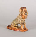 Pennsylvania redware figure of a seated dog 19th c