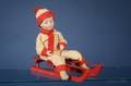 Heubach Bisque Boy on Sled Candy Container