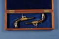 Cased Pair of Silver Inlaid Percussion Pistols by Smith
