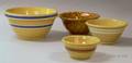 Three Yellowware Mixing Bowls and a Rockingham Glazed Pottery Bowl