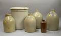 Four Assorted Stoneware Jugs a Bottle and Crock