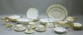Assembled Seventytwo Piece Gilt Porcelain Partial Dinner Set and Twentyone Pieces of Giltrimmed Colorless Glass Glassware