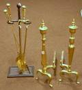Pair of Brass Urn Finial Andirons with an Iron Stand and a Set of Three Brass Hearth Tools