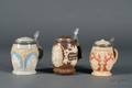 Three Mettlach Relief Steins