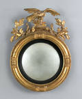 Regency carved giltwood convex mirror early 19th c