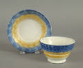 Blue and yellow rainbow spatter cup and saucer 19th c