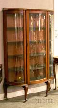 Early 20th Century Oak Serpentine China Cabinet