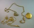 French 16kt Gold Box Link Chain an 8kt Gold Slide Chain and a 10kt Gold False Locket Pendant