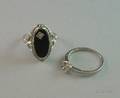 Art Deco White Gold and Onyx Ring and an Art Deco Iridium Platinum and Diamond Setting