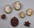 Three Pieces of Bohemian Garnet Jewelry and Four Shell Carved Cameo Brooches