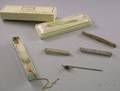 Group of Four Art Deco Bar Pins and Three Stickpins