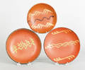 Three slip decorated redware plates 19th c