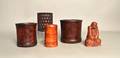 Four Chinese bamboo brush pots together with a carved wood figure