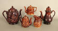 Four Rockingham glaze teapots