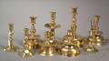 Group of Nine Continental Brass Candleholders and Accessories