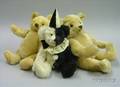 Two Steiff Yellow Mohair Teddy Bears and a Black and White Mohair Clown Bear