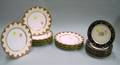 Set of Eleven Limoges Decorated Porcelain Plates and a Set of Seven Dresden Decorated Porcelain Plates