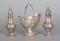 Pair of New York repousse silver pepper shakers and a swing handled basket ca 1860