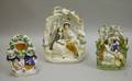 Two Staffordshire Pottery Couples Figurals and a Figural Watch Hutch