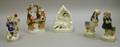 Four Staffordshire Pottery Figures and Figural Groups and a Figural Spill Vase