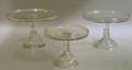 Three Graduated Colorless Pressed Glass Cake Pedestals