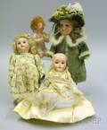 Three Small Bisque Head Dolls and a Small Bisque Piano Baby