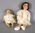German porcelain head doll together with a composition doll