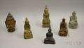 Six Assorted Metal and Stone Buddha Figures