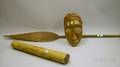 Ethnographic Carved Wooden Mask Paddle and a Decorated Bamboo Rhythm Instrument