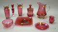 Nine Cranberry Glass Table Items