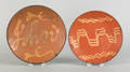 Two slip decorated redware plates 19th c