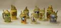 Seven German Stoneware Steins an RM Handpainted Ceramic Stein and an Enamel Decorated Glass Stein