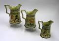 Three 1908 Buffalo Pottery Graduated Deldare Ware Pitchers