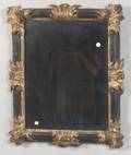 Continental Ebonized and Parcelgilt Mirror