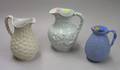 Three English Glazed Molded Stoneware Pitchers