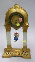 German Gilt Cast Metal and Glass Bouncing Doll Novelty Clock