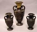 Three Continental Black Painted Terracotta Mantel Vases