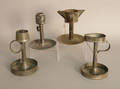Four early tin lamps