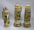 Three Large German Handpainted Relief Lidded Stoneware Steins