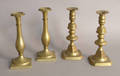 Two pairs of brass candlesticks