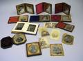 Sixteen Assorted 19th Century Portrait Photographs and a Small Album