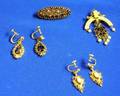 Two Pairs of 14kt Gold and Gemstone Earrings a 14kt Gold PendantBrooch and a Garnet Encrusted Brooch
