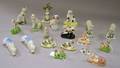 Sixteen Assorted Small English and Continental Ceramic Dog Figures a Pair of Sheep and a Seated Cat