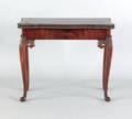 George II carved mahogany concertina action serpentine games table mid 18th c
