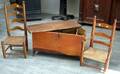 Two Childrens Slatback Chairs and a Small Red Stained SixBoard Blanket Chest