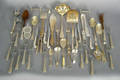 Group of silver plated flatware and sewing utensils