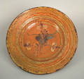 Large southern redware charger early 19th c