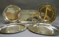 Four Assorted Sterling Silver Trays and a Christofle Silver Plated Tray
