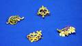 Four Small Gold and Goldfilled Pins